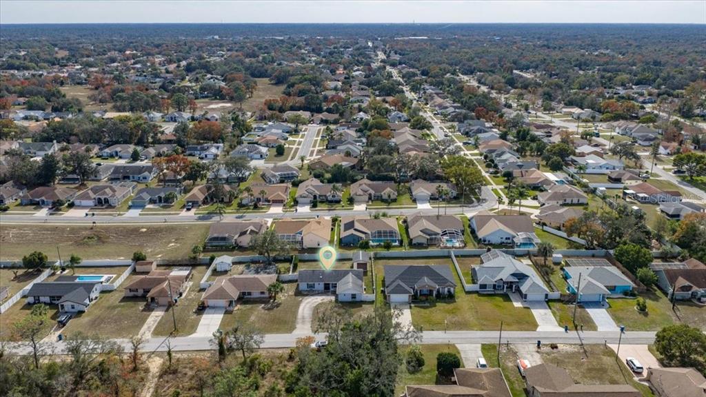 10290 Bannock Street Spring Hill, FL 34608 - Photo 36 of 40 an aerial view of a city with lots of residential buildings