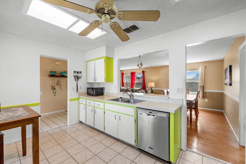 10290 Bannock Street Spring Hill, FL 34608 - Photo 5 of 40 a kitchen with a sink cabinets and window