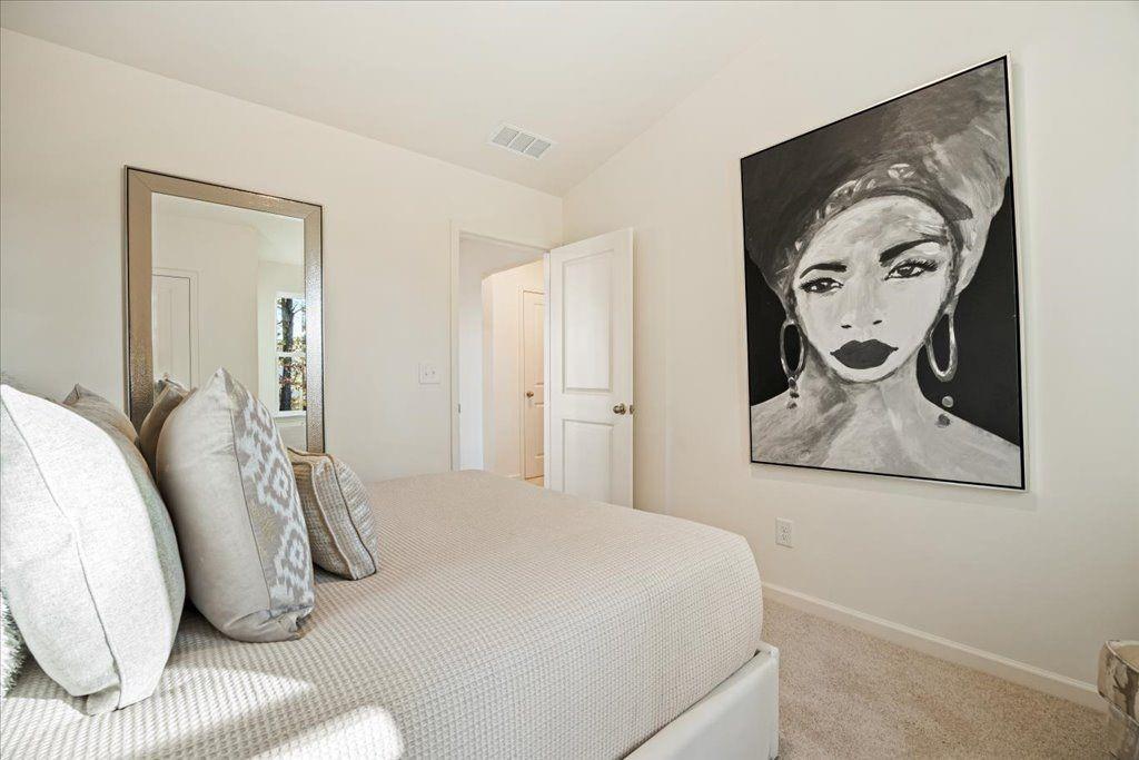 2555 Riverside Court Northeast Conyers, GA 30013 - Photo 18 of 33 a bedroom with a bed and painting on the wall