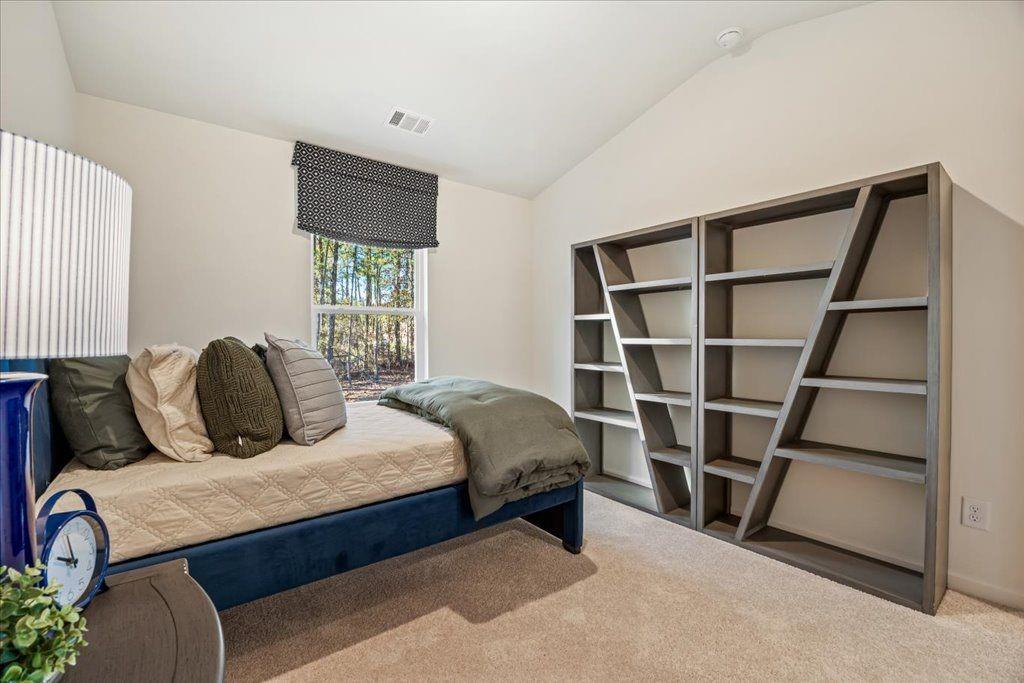2555 Riverside Court Northeast Conyers, GA 30013 - Photo 21 of 33 a bedroom with a bed closet and a window