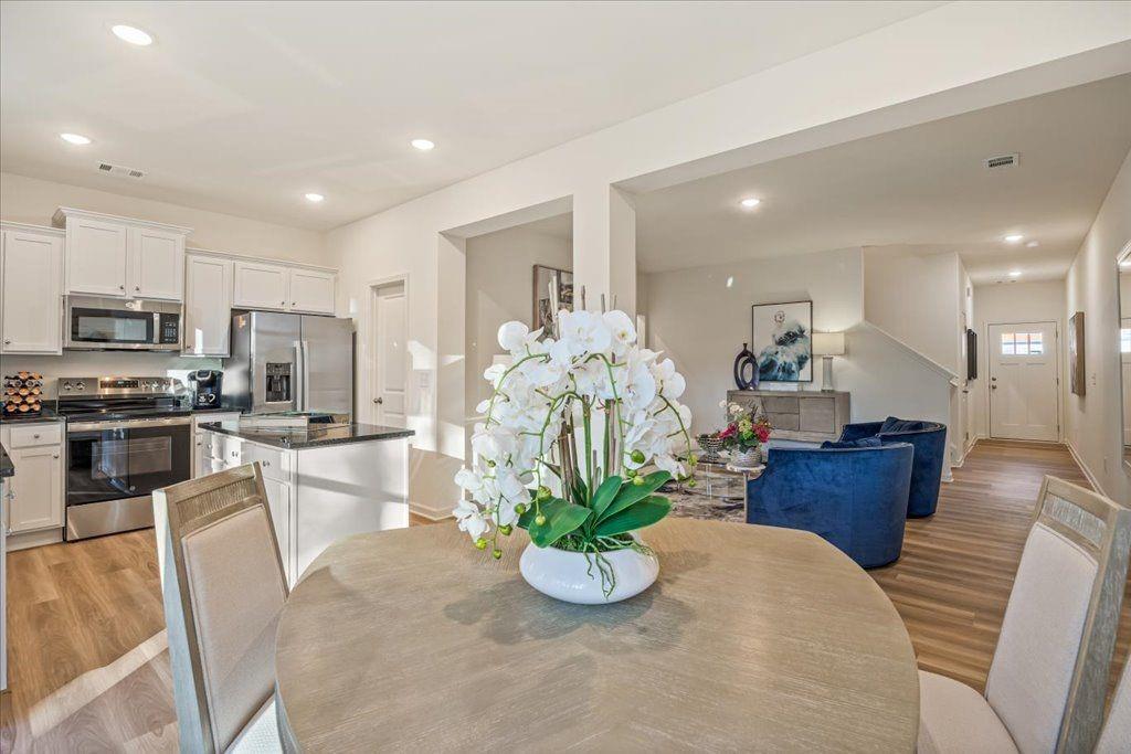 2555 Riverside Court Northeast Conyers, GA 30013 - Photo 4 of 33 a kitchen with furniture and a large window