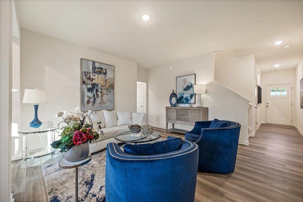 2555 Riverside Court Northeast Conyers, GA 30013 - Photo 5 of 33 a living room with furniture and a potted plant