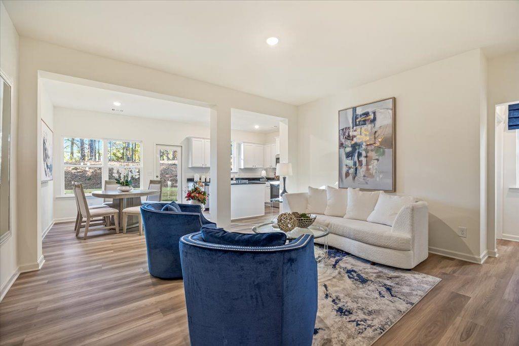 2555 Riverside Court Northeast Conyers, GA 30013 - Photo 8 of 33 a living room with furniture or couch and a wooden floor