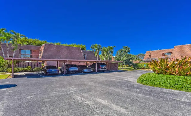 a sign that is sitting in front of flowers