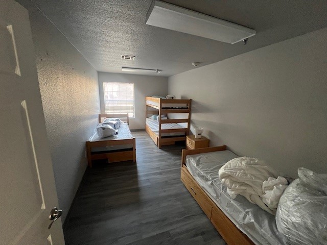 Undisclosed Address Killeen, TX 76543 - Photo 15 of 15 a bedroom with bed and wooden floor