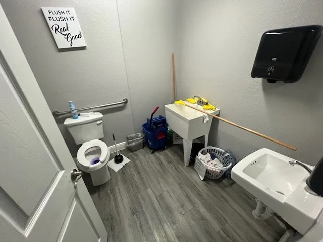 a view of living room with furniture and wooden floor