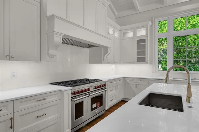 a kitchen with a refrigerator and countertop