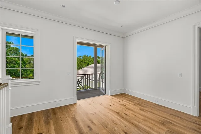 a bathroom with a toilet sink vanity granite and shower