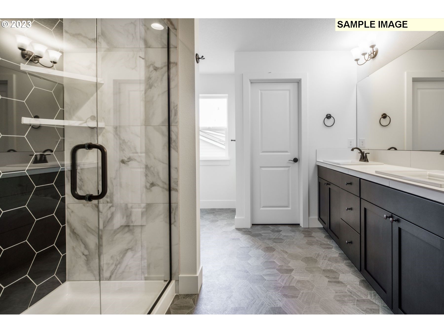 714 Northwest 178th Street Ridgefield, WA 98642 - Photo 27 of 31 a spacious bathroom with a shower and a sink