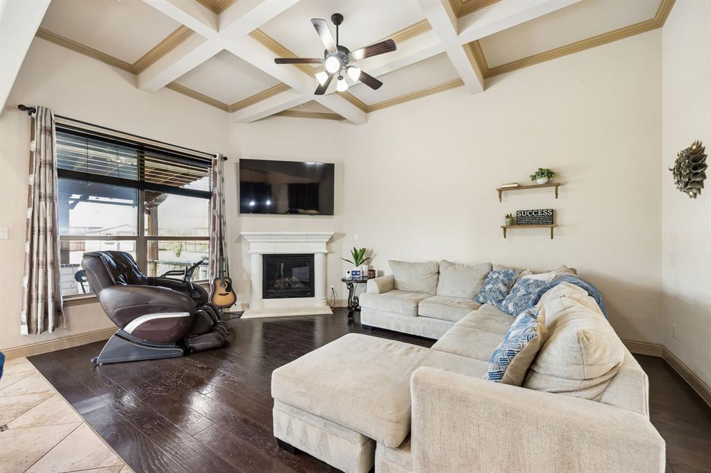 1341 Canary Lane Forney, TX 75126 - Photo 13 of 34 Living room with wood flooring and tray ceiling.
