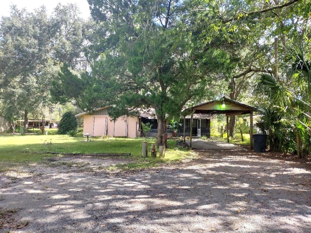 651 Old Haw Creek Road Bunnell, FL 32110 - Photo 28 of 28 a front view of a house with a yard and trees