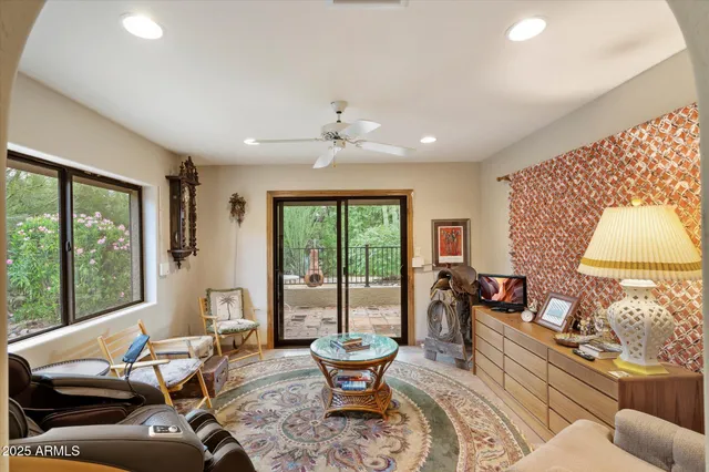a living room with furniture and a large window