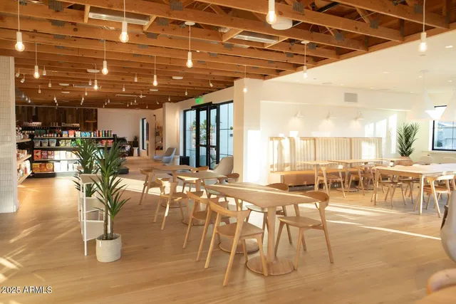 a bedroom with a bed and lamp