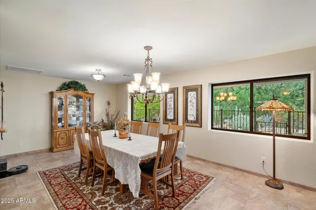 a view of a dining room with furniture window and outside view