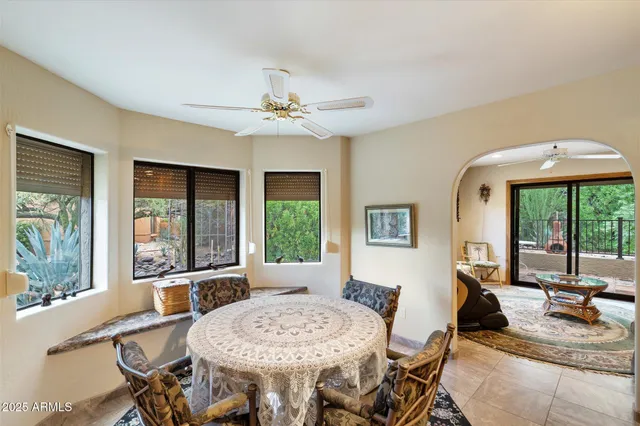 a view of a dining room with furniture window and outside view