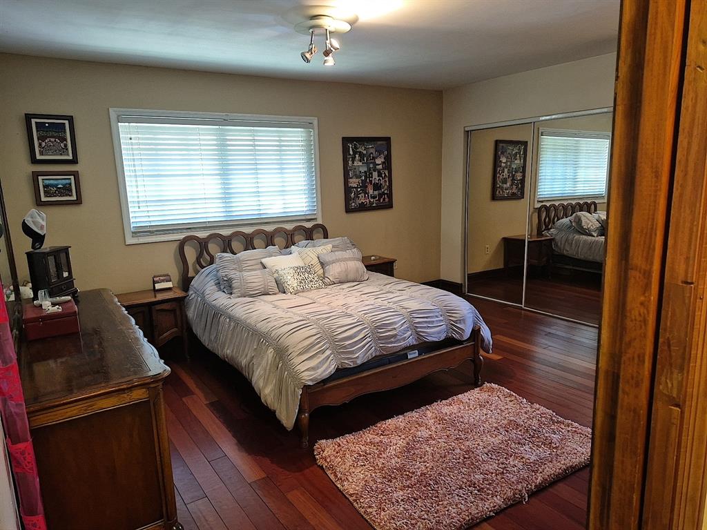 11081 Southwest 30th Court Davie, FL 33328 - Photo 15 of 29 a bedroom with a bed and wooden floor