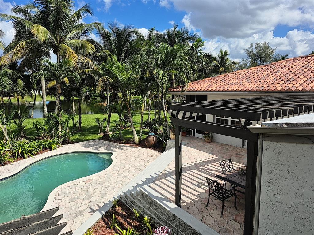 11081 Southwest 30th Court Davie, FL 33328 - Photo 16 of 29 a view of a swimming pool with a patio
