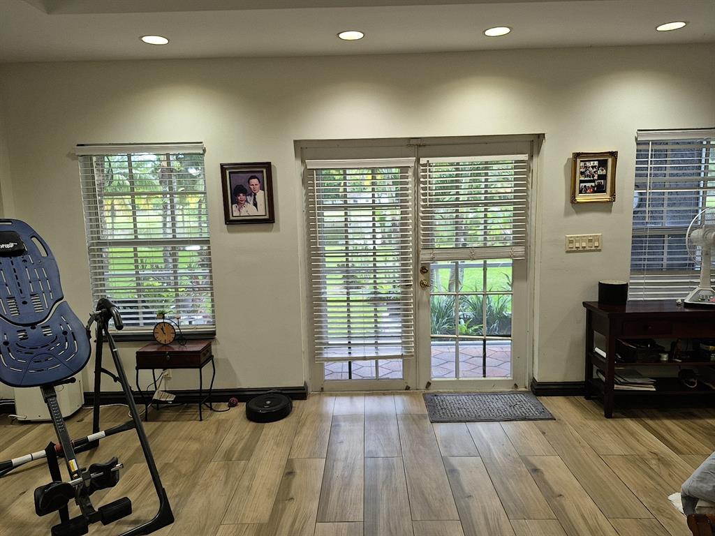 11081 Southwest 30th Court Davie, FL 33328 - Photo 23 of 29 a living room with furniture and a floor to ceiling window