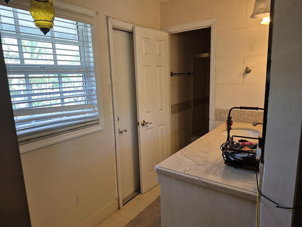 11081 Southwest 30th Court Davie, FL 33328 - Photo 25 of 29 a bathroom with a sink and a mirror