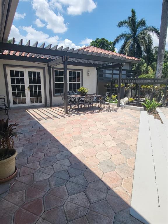 11081 Southwest 30th Court Davie, FL 33328 - Photo 6 of 29 a view of the house with backyard and sitting area