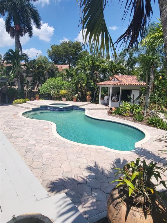 11081 Southwest 30th Court Davie, FL 33328 - Photo 7 of 29 a view of a swimming pool with a garden