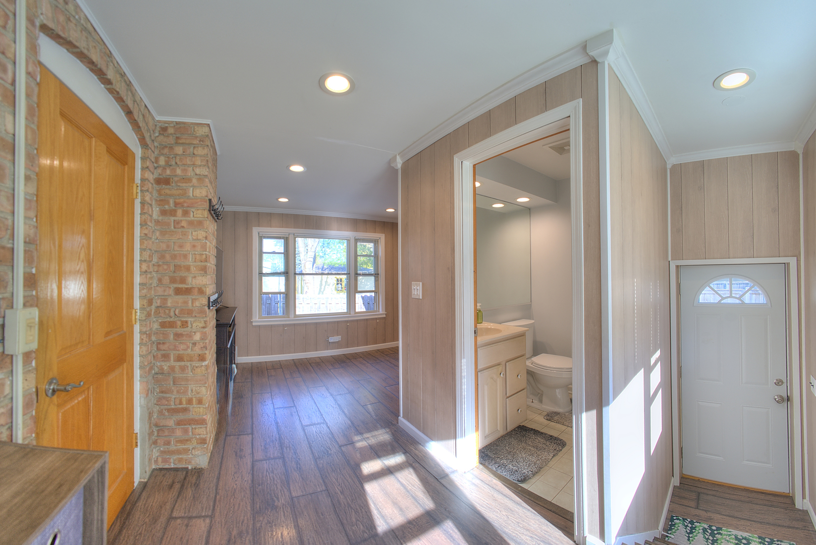 501 North Maple Street Mount Prospect, IL 60056 - Photo 13 of 27 a view of a hallway with wooden floor and a bathroom