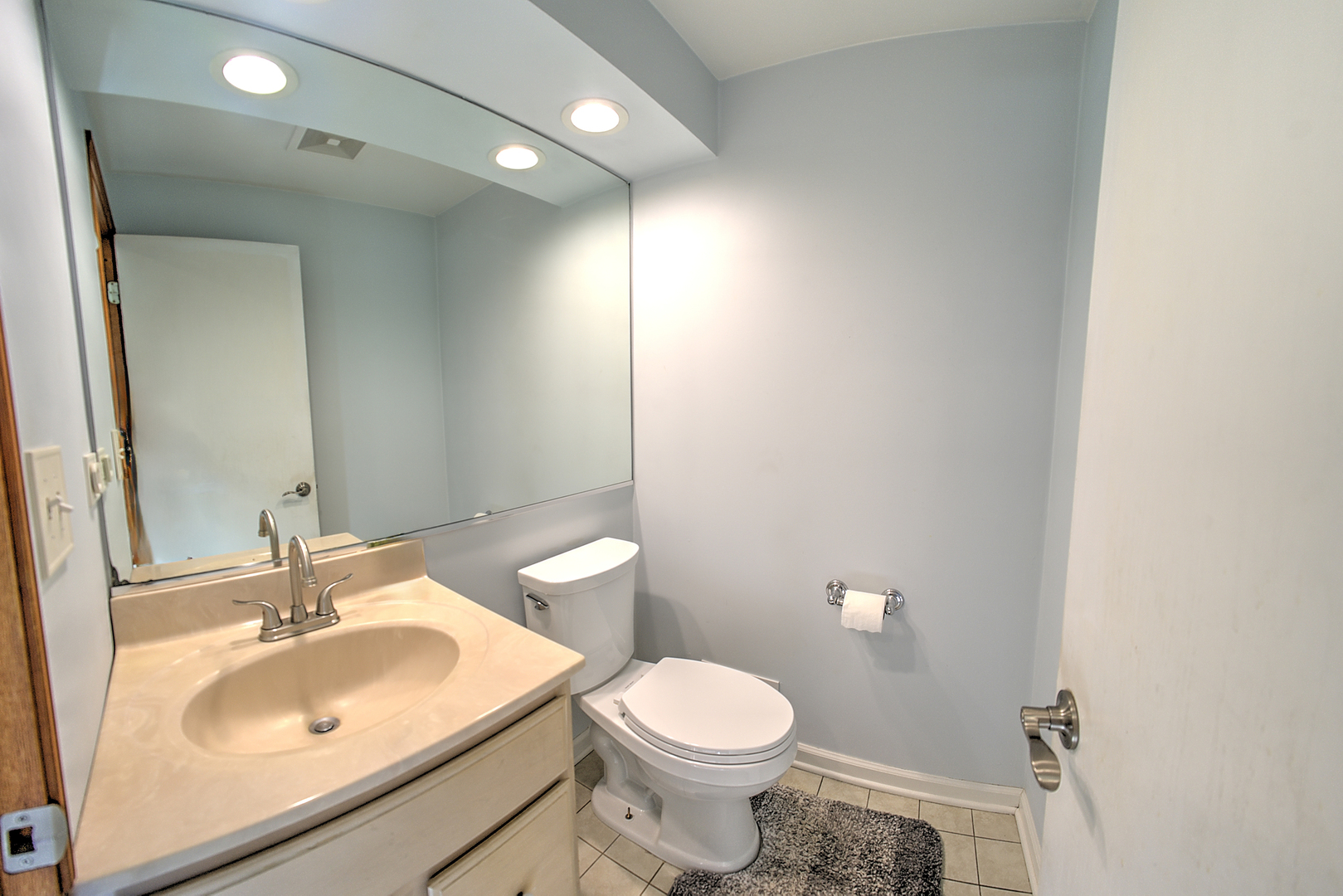 501 North Maple Street Mount Prospect, IL 60056 - Photo 15 of 27 a bathroom with a sink toilet and a mirror