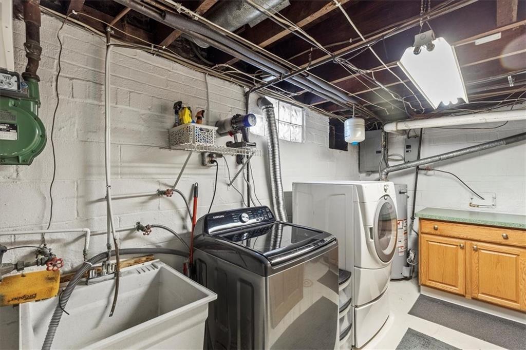 322 Ohio Avenue Rochester, PA 15074 - Photo 41 of 47 a utility room with multiple dryer and washer