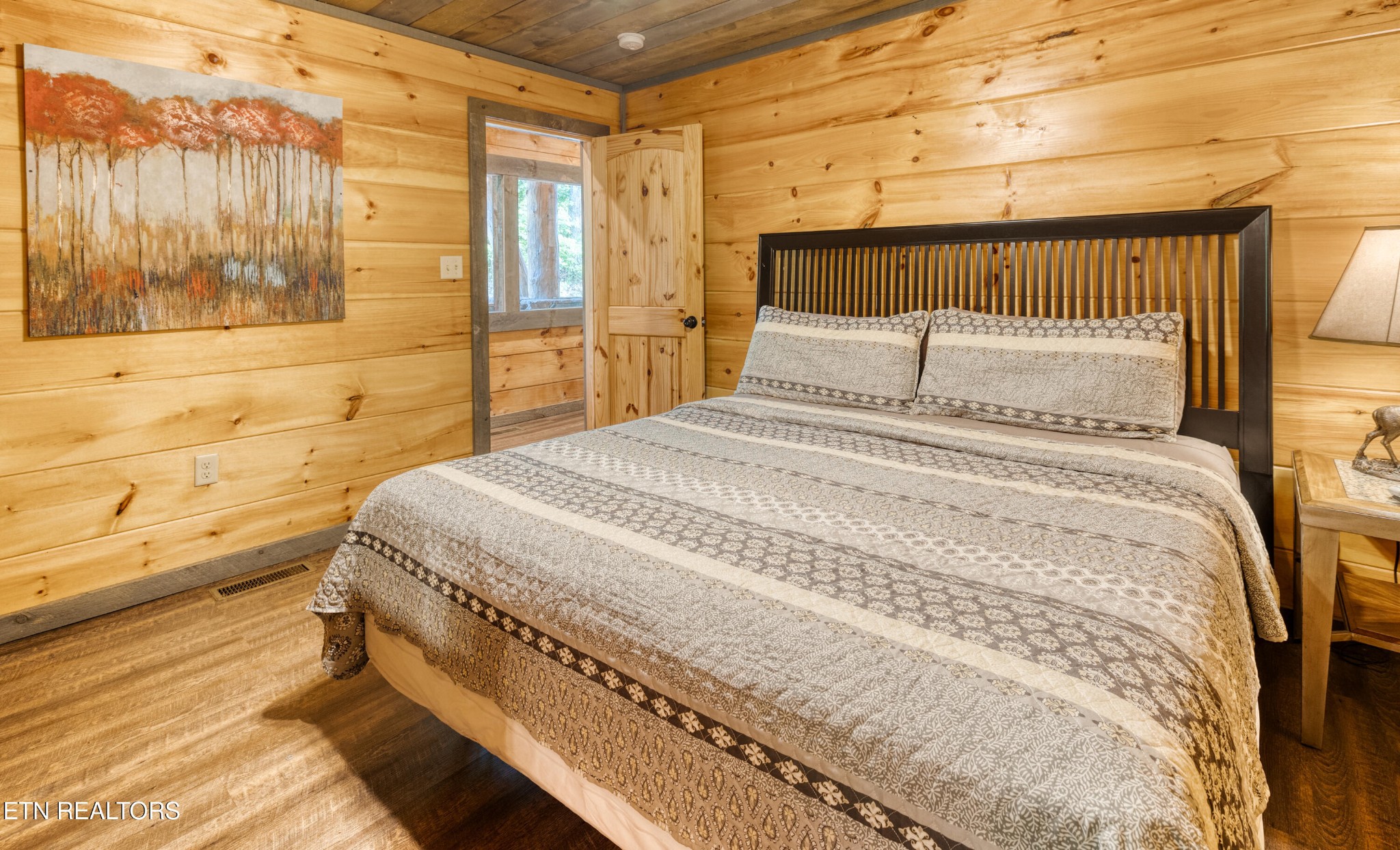 809 Pinecrest Way Sevierville, TN 37862 - Photo 18 of 60 a bed sitting in a bedroom next to a window