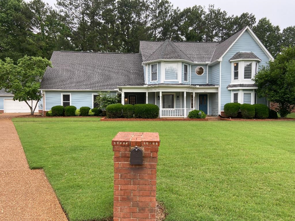 1212 Heather Ridge Cove Collierville, TN 38017 - Photo 1 of 25 a front view of a house with a yard