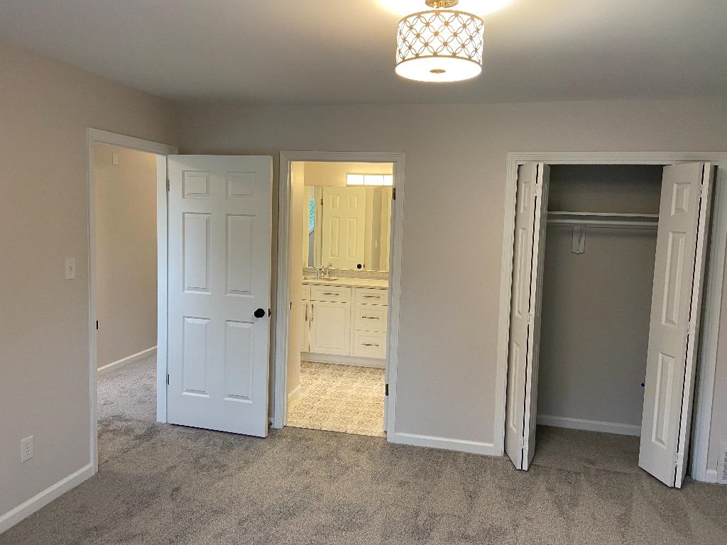 1212 Heather Ridge Cove Collierville, TN 38017 - Photo 12 of 25 an empty room with windows and closet