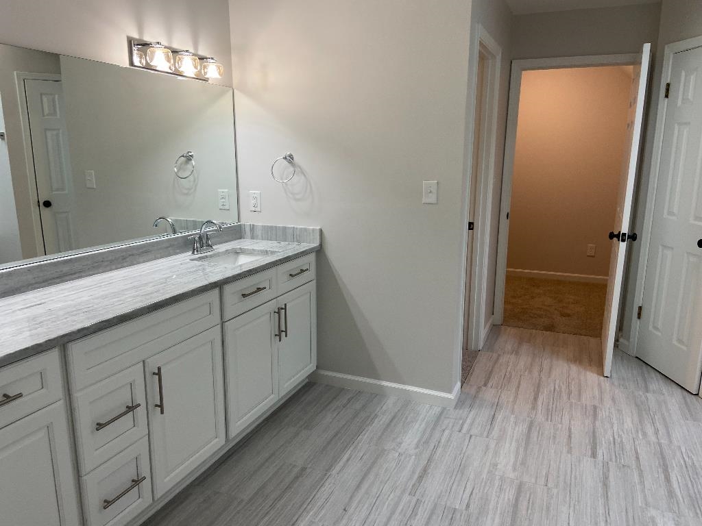 1212 Heather Ridge Cove Collierville, TN 38017 - Photo 18 of 25 a bathroom with a double vanity sink and mirror