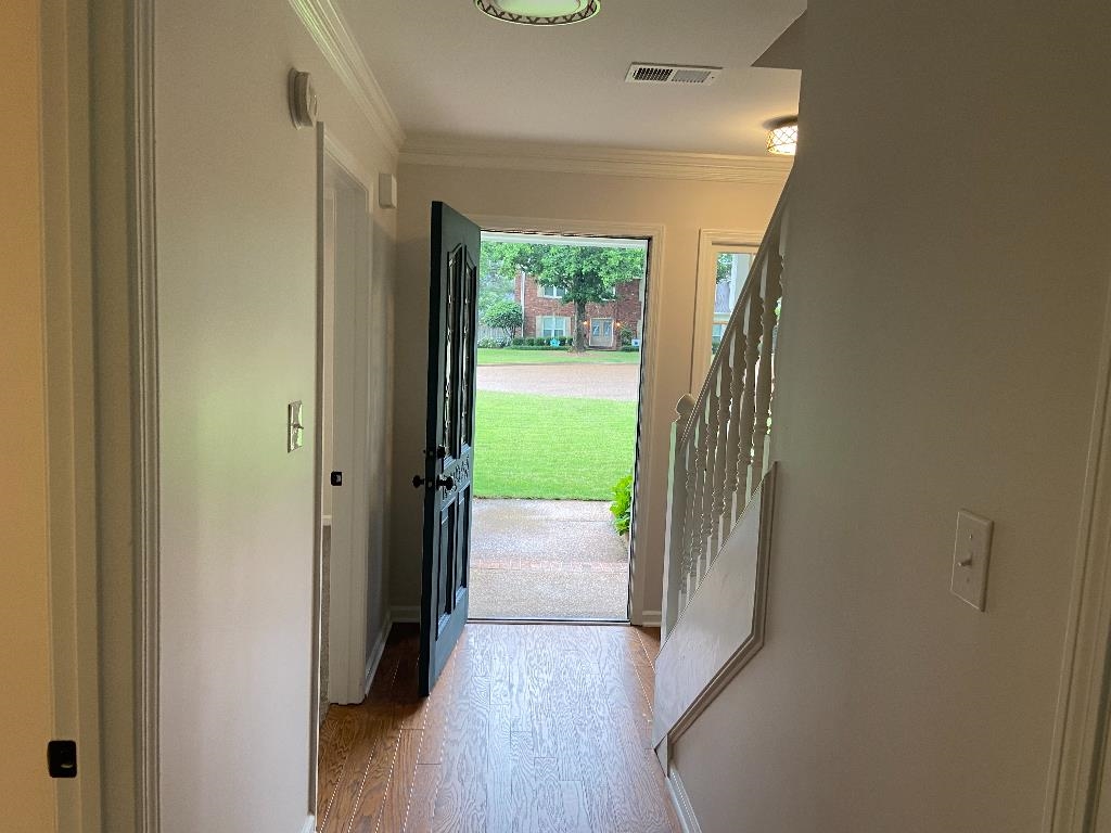 1212 Heather Ridge Cove Collierville, TN 38017 - Photo 3 of 25 a view of hallway with window and wooden floor