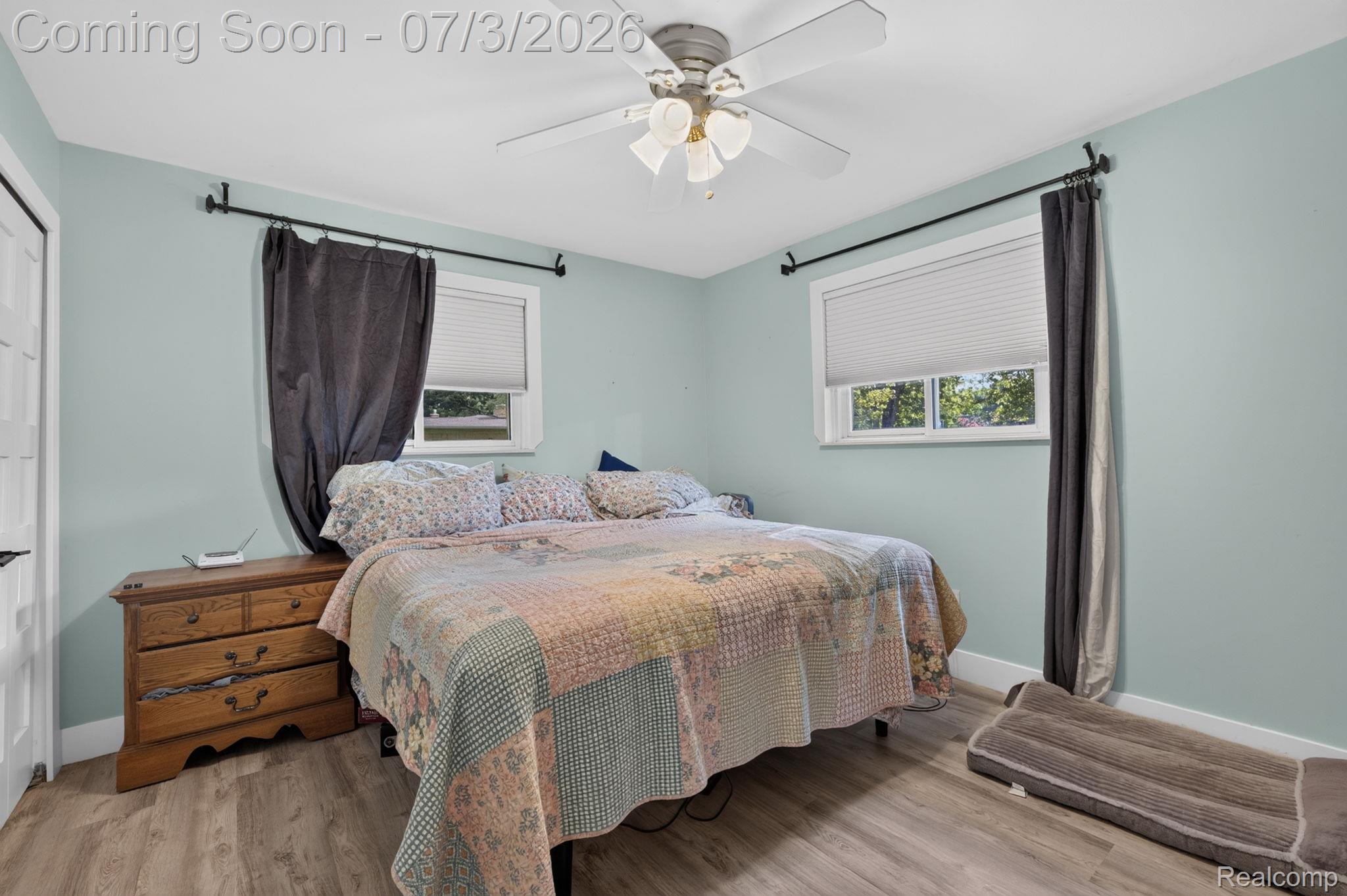 5355 North Seymour Road Flushing, MI 48433 - Photo 26 of 41 Interior room featuring light blue walls, wood-finish flooring, and white trim