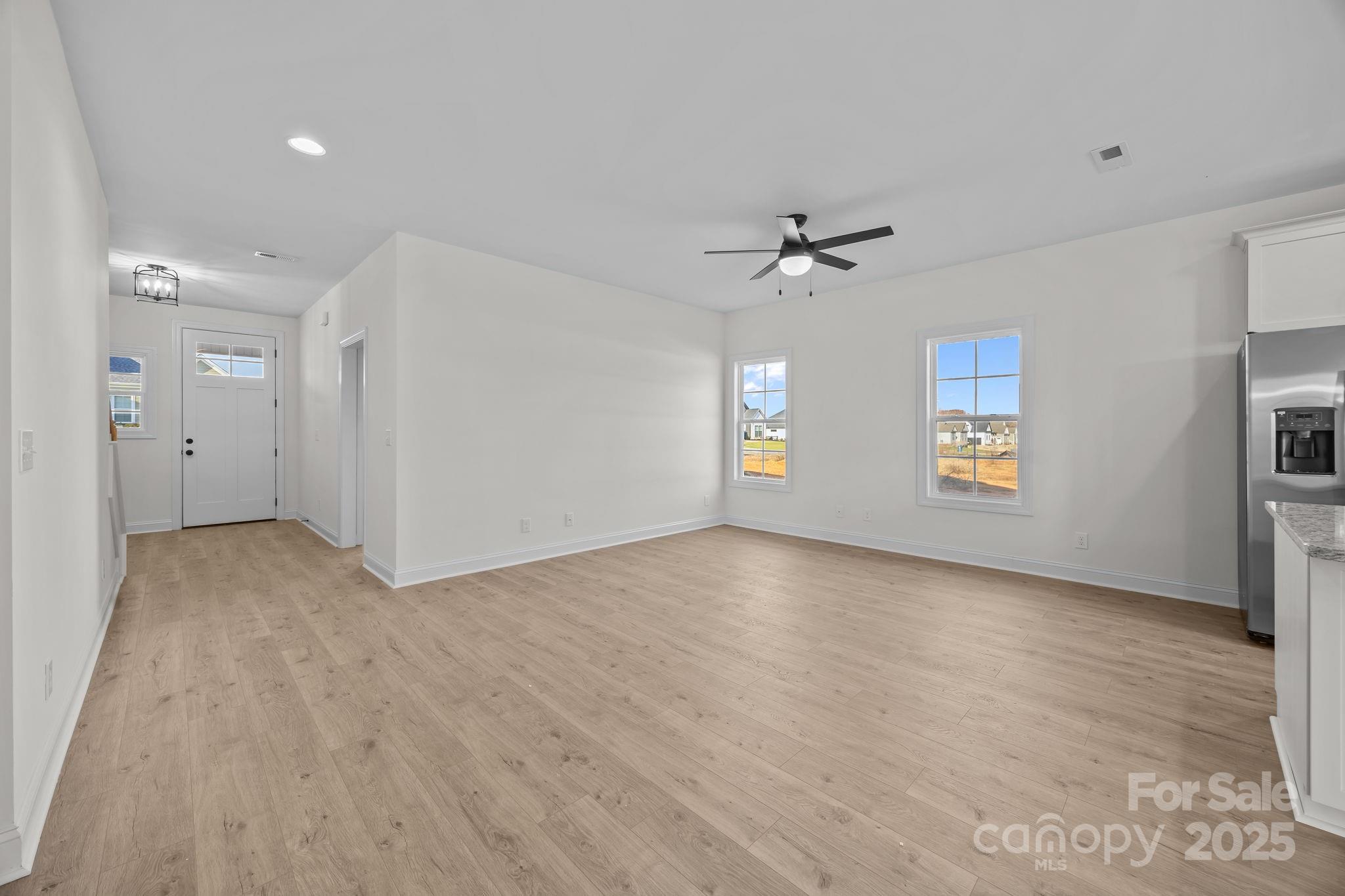 1325 Coppergate Drive Salisbury, NC 28147 - Photo 12 of 47 wooden floor in an empty room with a window