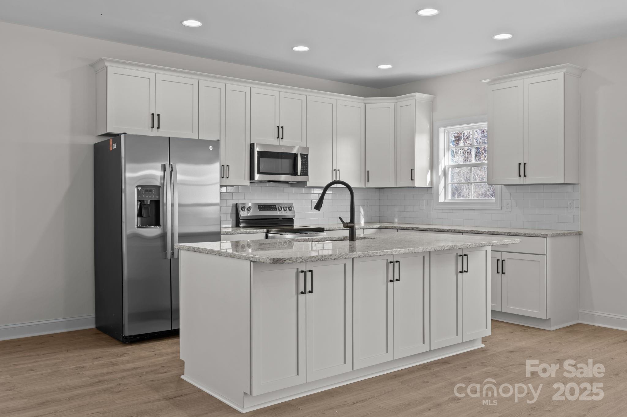 1325 Coppergate Drive Salisbury, NC 28147 - Photo 13 of 47 a kitchen with cabinets stainless steel appliances and a counter space