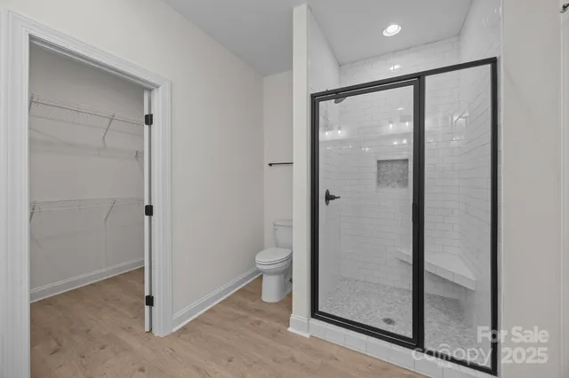 a bathroom with a glass shower door