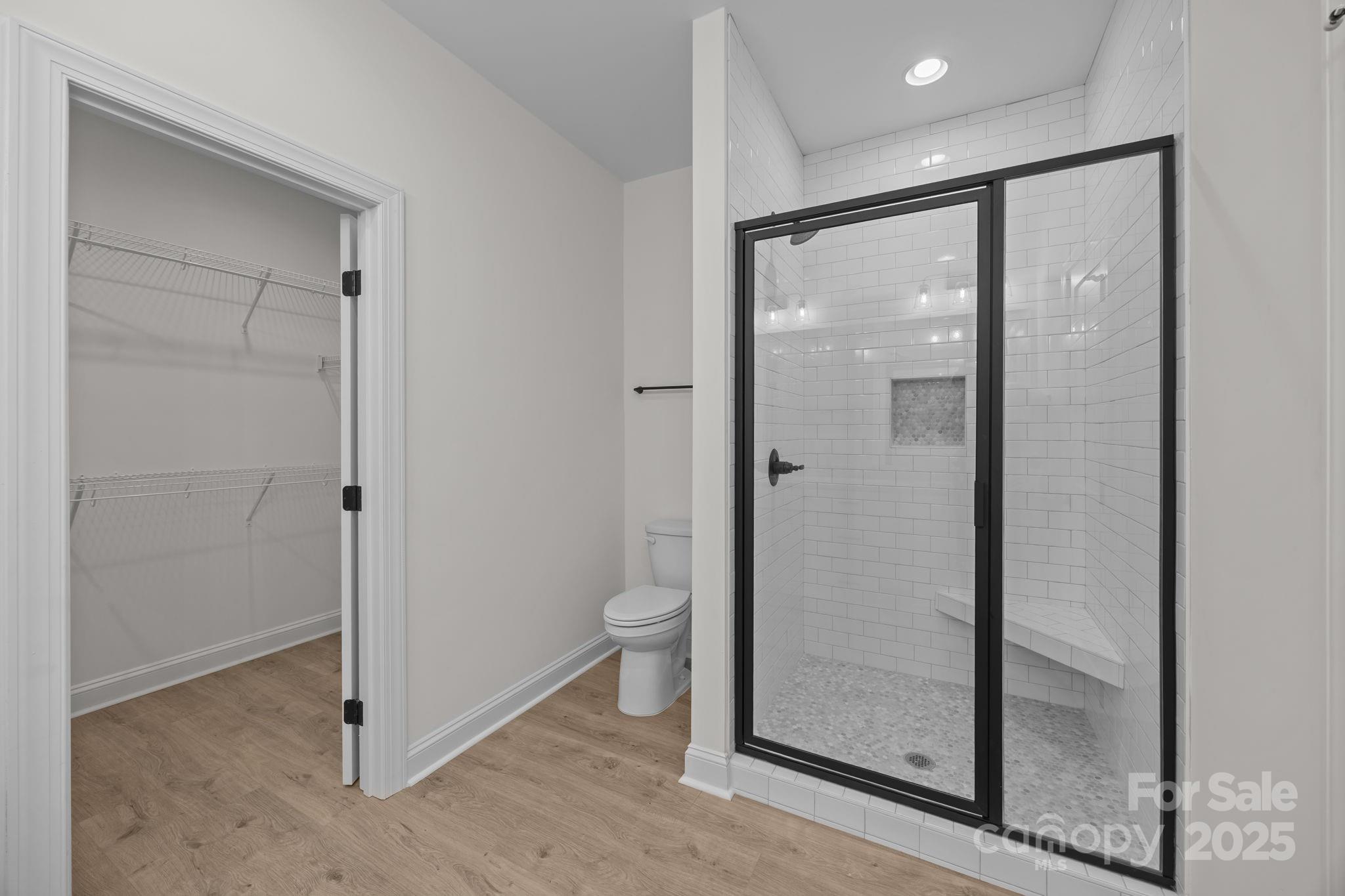1325 Coppergate Drive Salisbury, NC 28147 - Photo 23 of 47 a bathroom with a glass shower door