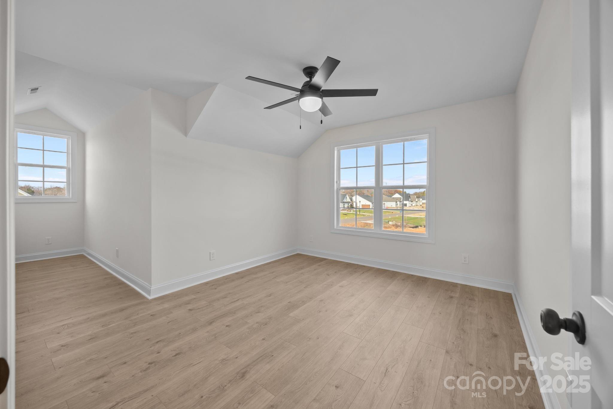 1325 Coppergate Drive Salisbury, NC 28147 - Photo 26 of 47 wooden floor in an empty room with a window