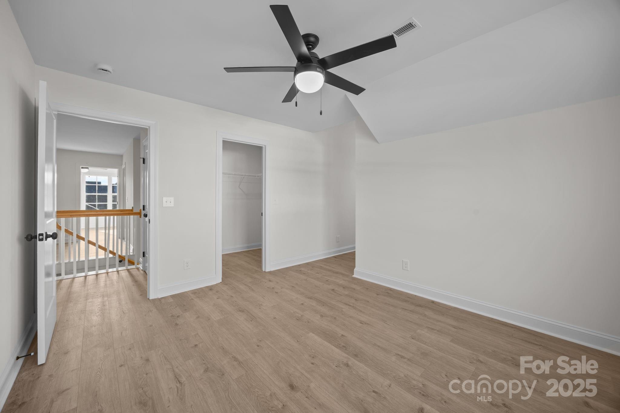 1325 Coppergate Drive Salisbury, NC 28147 - Photo 27 of 47 wooden floor in an empty room with a window