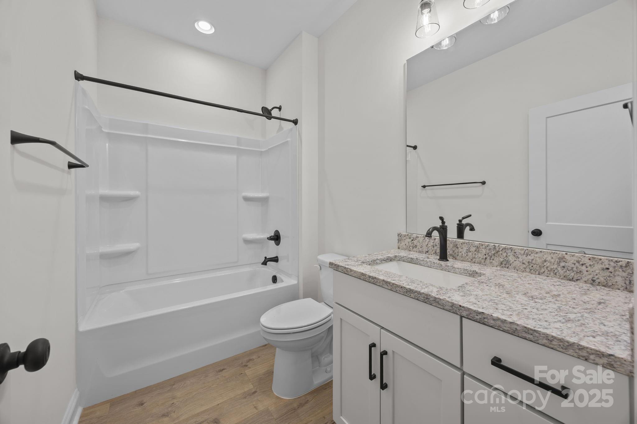 1325 Coppergate Drive Salisbury, NC 28147 - Photo 9 of 47 a bathroom with a granite countertop sink toilet and shower