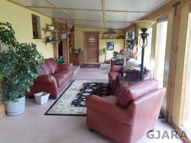 602 39 Road Palisade, CO 81526 - Photo 3 of 19 a living room with furniture and a potted plant