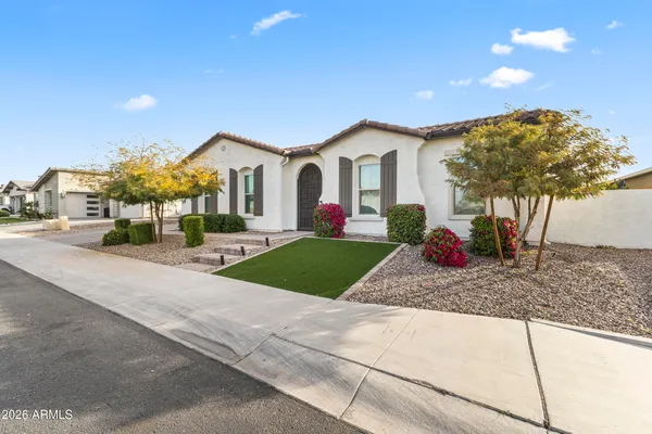 a view of a house with a yard and tree s