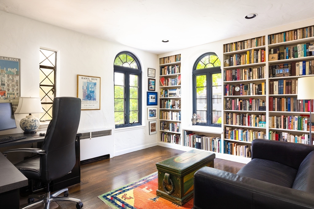 5 Southwick Road Newton, MA 02468 - Photo 18 of 25 a living room with furniture a bookshelf and a window