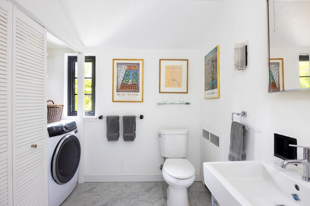 5 Southwick Road Newton, MA 02468 - Photo 20 of 25 a bathroom with a toilet sink and mirror