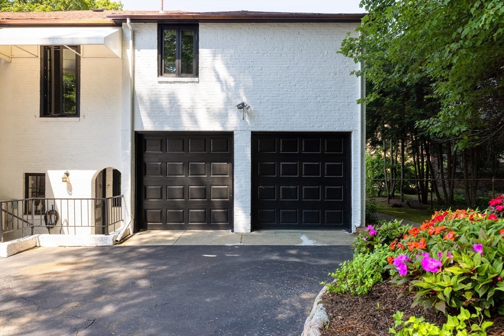 5 Southwick Road Newton, MA 02468 - Photo 24 of 25 a front view of a house with a garage