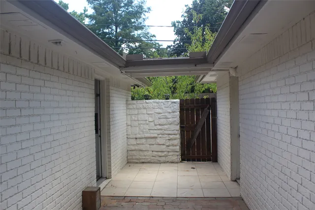 a garden with wooden fence