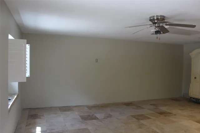 a kitchen with white cabinets and a stove top oven