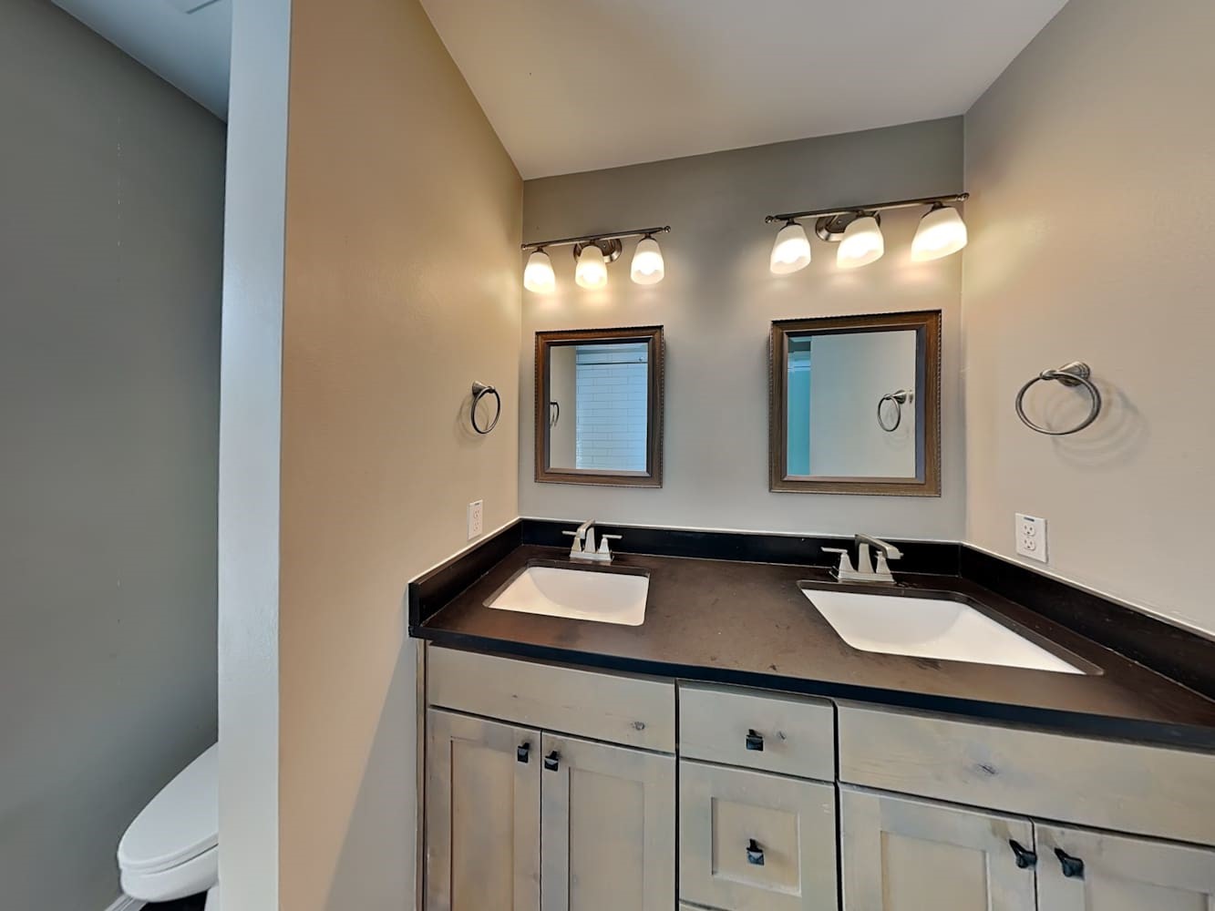 179 Holly Street, Unit 102 Georgetown, TX 78626 - Photo 12 of 17 a bathroom with a sink and a mirror