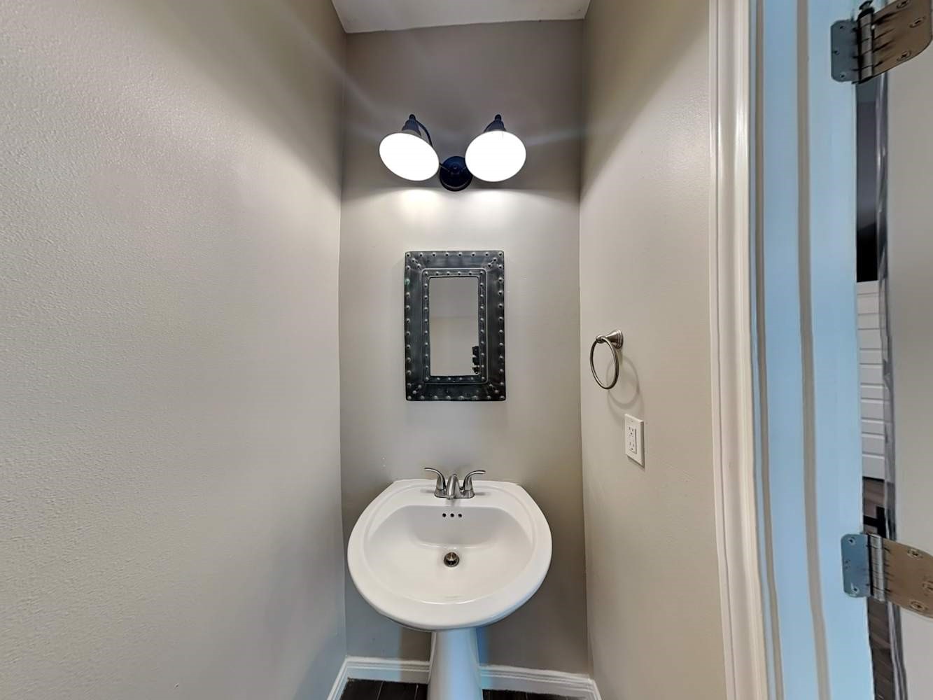 179 Holly Street, Unit 102 Georgetown, TX 78626 - Photo 16 of 17 a bathroom with a sink and a mirror